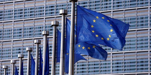 European Union flags flutter outside the EU Commission headquarters in Brussels, Belgium, April 20, 2016. 