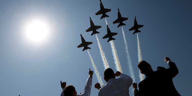 The Blue Angels perform a fly-over at the start of the graduation and commissioning ceremony at the U.S. Naval Academy in Annapolis, Maryland, May 27.