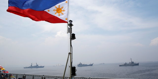 A Philippine flag flutters on the Strategic Sealift Vessel BRP Tarlac LD601 during the commissioning ceremony of the newly acquired BRP Tarlac and three Landing Craft Heavies (LCHs) at the celebration of Philippine Navy's 118th anniversary in Manila, Philippines June 1, 2016.