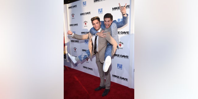 Cast members Zac Efron and Adam Devine attend the premiere of "Mike and Dave Need Wedding Dates" in Hollywood, California, U.S. June 29, 2016. REUTERS/Phil McCarten - RTX2IYMF