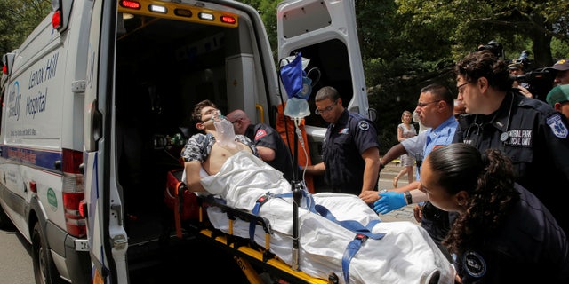 A man is loaded into an ambulance after he was injured in an explosion in Central Park.