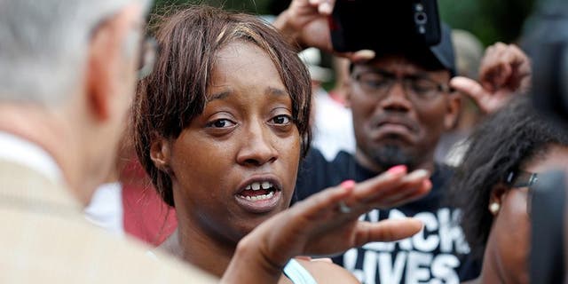 Diamond Reynolds recounts the incidents that led to the fatal shooting of her boyfriend Philando Castile by Minneapolis area police during a traffic stop on Wednesday, at a "Black Lives Matter" demonstration in front of the Governor's Mansion in St. Paul, Minnesota, U.S., July 7, 2016. (REUTERS/Eric Miller)