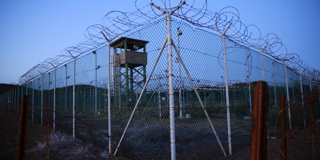FILE PHOTO - Chain link fence and concertina wire surrounds a deserted guard tower within Joint Task Force Guantanamo's Camp Delta at the U.S. Naval Base in Guantanamo Bay, Cuba March 21, 2016. REUTERS/Lucas Jackson/File Photo TPX IMAGES OF THE DAY - S1AETVRIXQAA