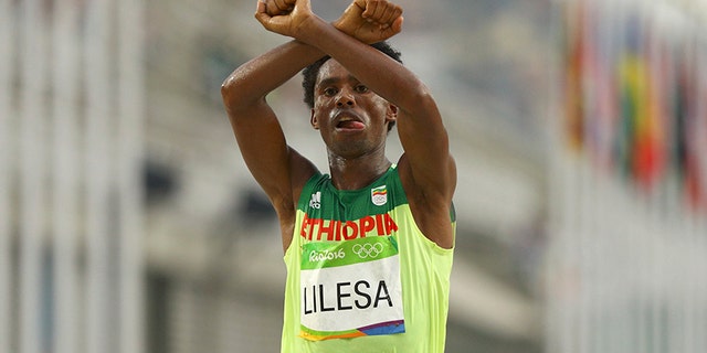 Marathoner Feyisa Lilesa of Ethiopia has been exiled after he crossed his arms over his head at the finish line in protest of his country's treatment of his ethnic group at the 2016 Rio Games.