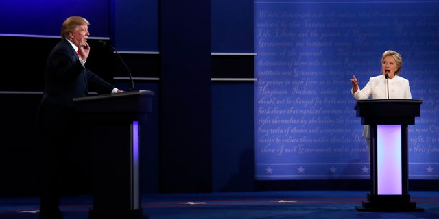 Republican U.S. presidential nominee Donald Trump and Democratic nominee Hillary Clinton speak at the same time as they discuss an issue during their third and final 2016 presidential campaign debate at UNLV in Las Vegas, Nevada, U.S., October 19, 2016. REUTERS/Carlos Barria TPX IMAGES OF THE DAY - RTX2PLZM