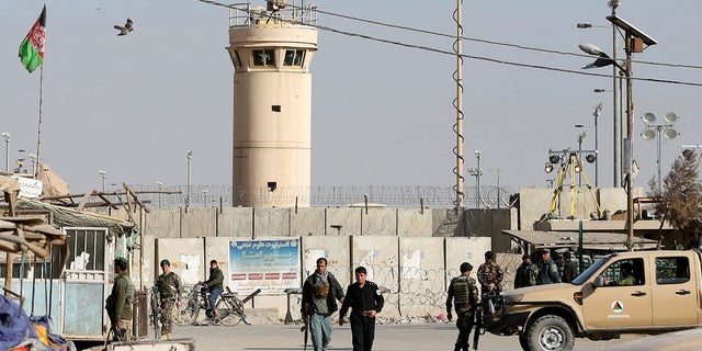 Five U.S. troops were wounded when a suicide bomber drove a car bomb into an armored convoy outside Bagram Air Base.