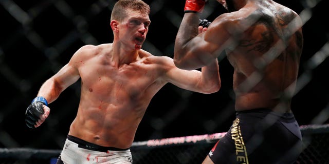 Nov 12, 2016; New York, NY, USA; Tyron Woodley (red gloves) fights against Stephen Thompson (blue gloves) in their welterweight title bout during UFC 205 at Madison Square Garden. Mandatory Credit: Adam Hunger-USA TODAY Sports - RTX2TEI2