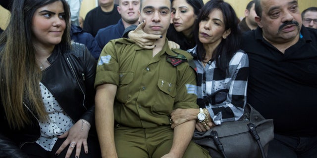 Israeli soldier Elor Azaria, center, sitting to hear the verdict on Wednesday.
