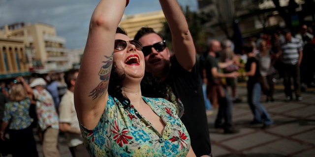 People dressed in fifties-style outfits dance during the 23rd Rockin' Race Jamboree International Festival in downtown Torremolinos, near Malaga, southern Spain February 4, 2017. REUTERS/Jon Nazca - RTX2ZN4R
