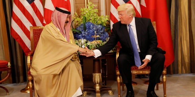 FILE - President Donald Trump meets with King Hamad bin Isa Al Khalifa of Bahrain in Riyadh, Saudi Arabia, May 21, 2017.