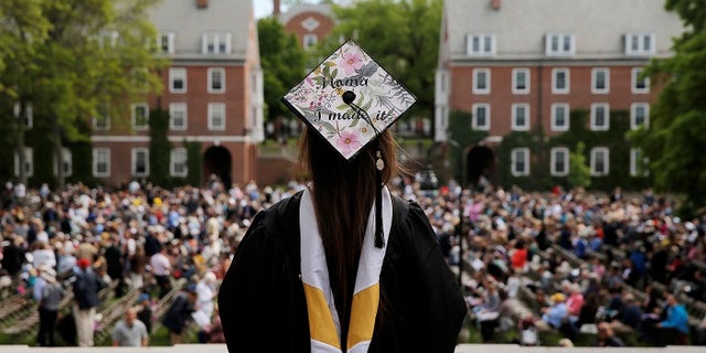 Senior Kayla Ray Madison has "Mama I Made It" written on her cap as she waits to graduate during Commencement at Smith College in Northampton, Massachusetts, U.S., May 21, 2017. REUTERS/Brian Snyder - RTX36W1W