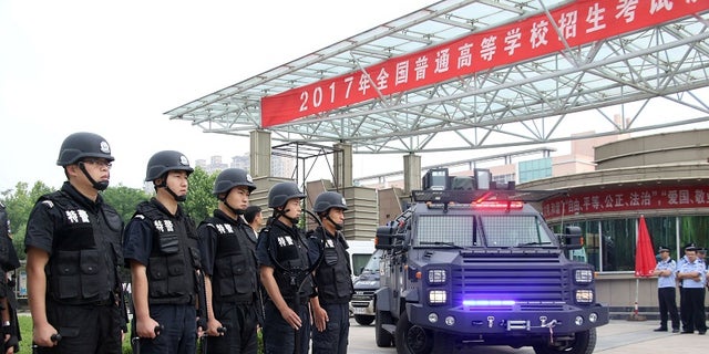Special force police officers stand guard outside a high school, on the first day of China's national college entrance exam known as "gaokao", in Binzhou, Shandong province, China June 7, 2017.