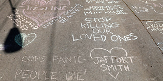 Memorials on the alleyway for Justine Damond who was shot by a Minneapolis police officer in Minneapolis, Minnesota, U.S., July 17, 2017.