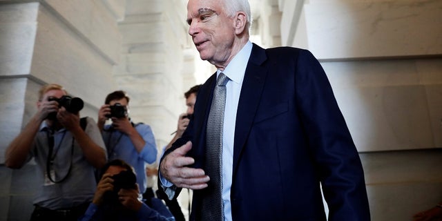 Sen. John McCain departs after returning to the Senate to vote on health care legislation on Capitol Hill.