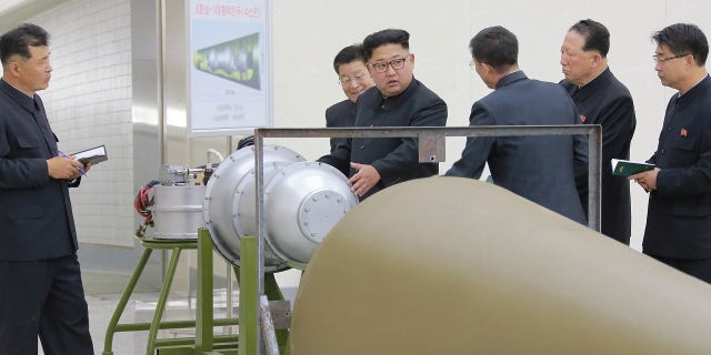 Kim Jong Un inspects what North Korea claims to be a nuclear warhead. The photos were released the same day North Korea conducted its sixth nuclear test in September.