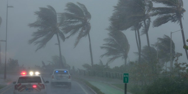 Police patrol the area as Hurricane Irma slams across islands in the northern Caribbean on Wednesday, in San Juan, Puerto Rico September 6, 2017.