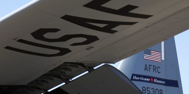 FILE -- A tail of the WC-130J Super Hercules from the Air Force's 53rd Weather Reconnaissance Squadron bears the name "Hurricane Hunters" as the plane awaits its departure from Keesler Air Force Base in Biloxi, Mississippi.
