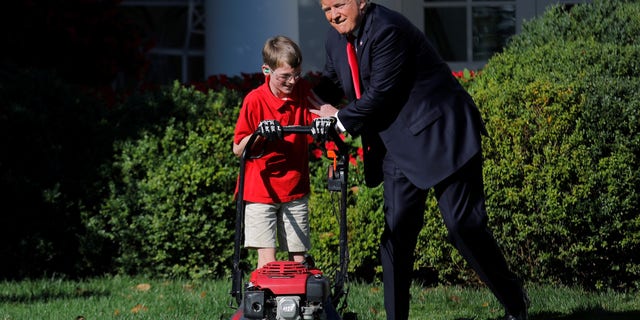 President Trump welcomes 11-year-old Frank Giaccio as he cuts the Rose Garden grass.