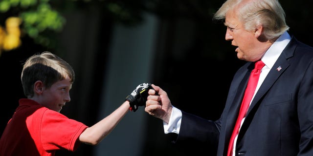 President Trump shakes hands with 11-year-old Frank Giaccio.