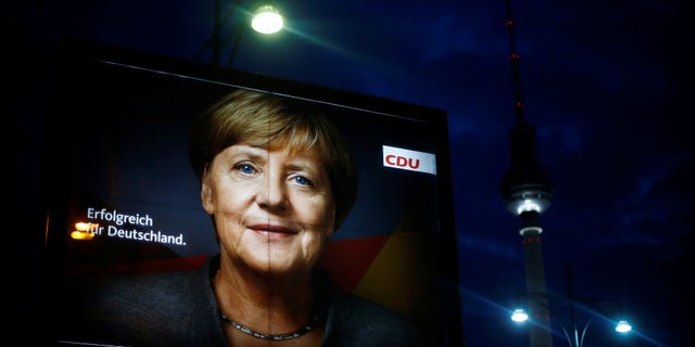 An election campaign poster for the upcoming general elections of the Christian Democratic Union party (CDU) with a headshot of German Chancellor Angela Merkel is displayed at Alexanderplatz square in Berlin, Germany, September 21, 2017.