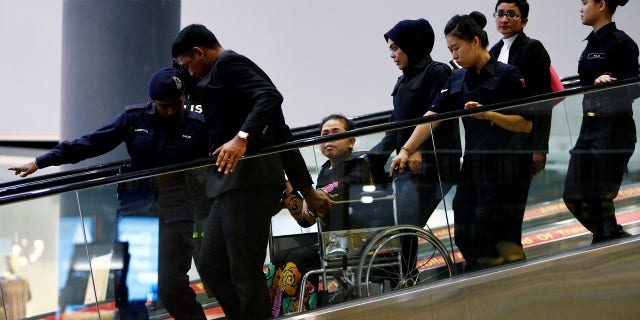Siti Aisyah was placed in a wheelchair after complaining of exhaustion.