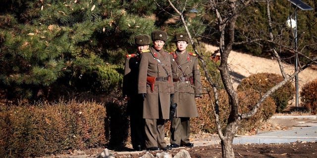 North Korean soldiers keep watch toward the south next to a spot where a North Korean has defected crossing the border on November 13, at the truce village of Panmunjom inside the demilitarized zone, South Korea, November 27, 2017. REUTERS/Kim Hong-Ji TPX IMAGES OF THE DAY - RC1879318990
