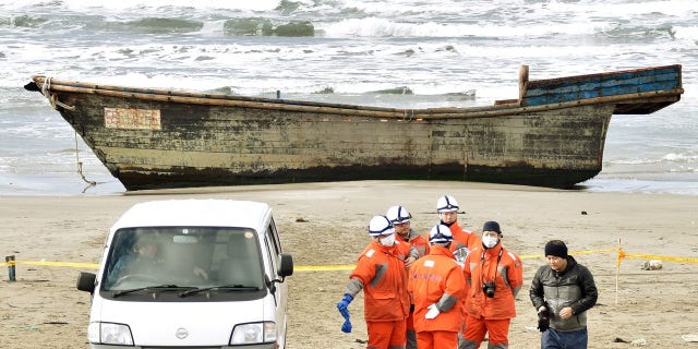 The wooden boat filled with skeletal remains was discovered by a Japanese resident on Friday.