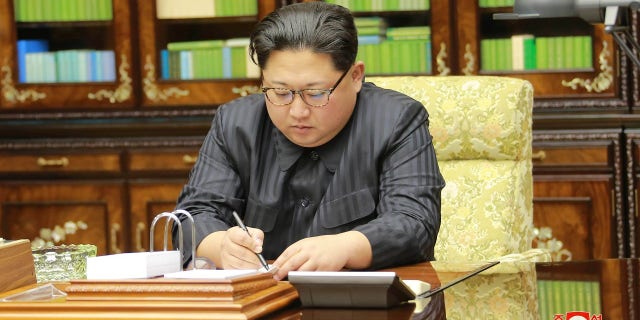 North Korea releases photo of Kim Jong Un the same day the regime launched an ICBM