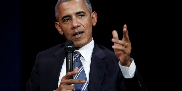FILE - Former President Barack Obama speaks at a conference during his first visit to France since he left the White House.