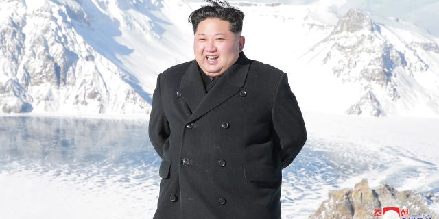 Kim Jong Un was pictured strolling near Mount Paektu to celebrate North Korea's recent ICBM test.