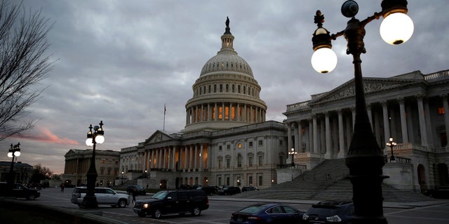 The U.S. Capitol building is lit at dusk in Washington, U.S., December 18, 2017.