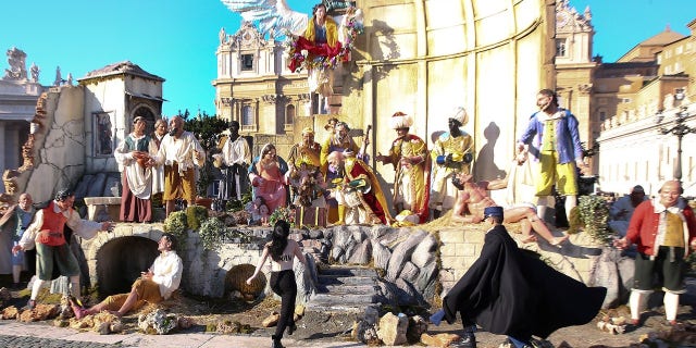 The topless activist was seen charging toward the nativity scene in Vatican City on Christmas.