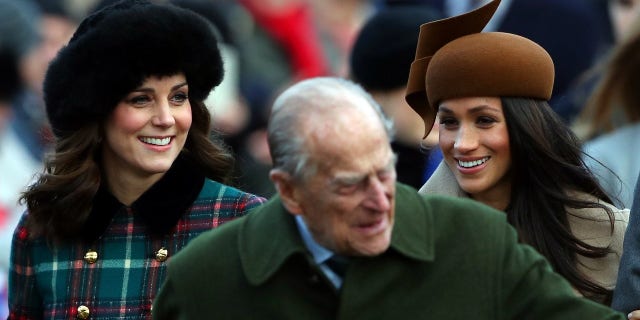 Kate Middleton and Meghan Markle talk while arriving for the Christmas service.