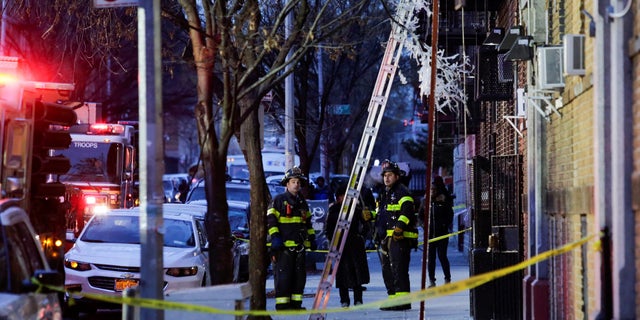 Fire Department of New York personnel at the scene of the devastating apartment fire in the Bronx.