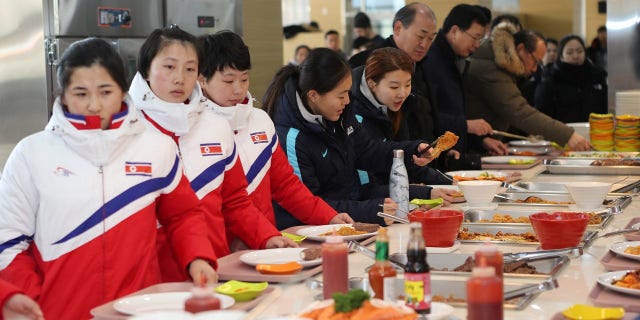 North and South Korea hockey players joined together on Thursday.
