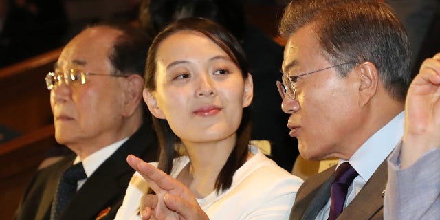 South Korean President Moon Jae-in, right, talks with Kim Yo Jong while watching North Korea's Samjiyon Orchestra.