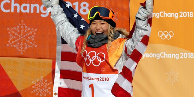 Chloe Kim of the U.S. celebrates after she became the youngest woman to win an Olympic snowboarding gold medal.