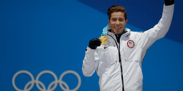 Gold medallst Shaun White of the U.S. on the podium.