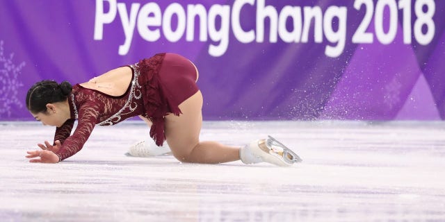 Mirai Nagasu's second attempt at the triple axel ended up with her falling on her knees and hands.
