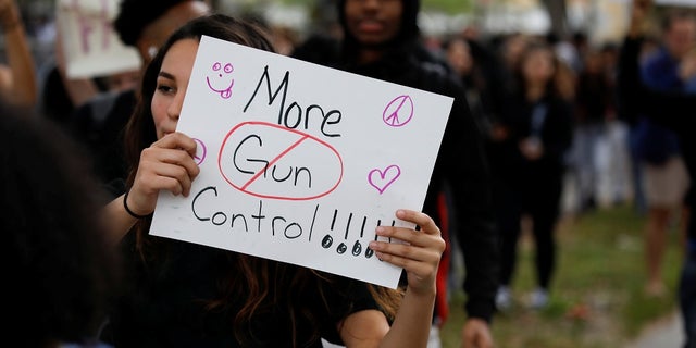 In this February 2018 photo, students from Plantation High School protest in support of gun control following at mass shooting at Marjory Stoneman Douglas High School. On Wednesday, students and parents from Broward County School district met for a forum on school safety.