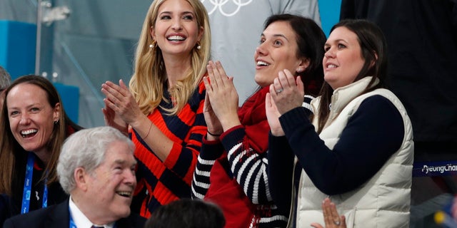 White House press secretary Sarah Sanders, far right, cheers on U.S. Olympic athletes along with Ivanka Trump in South Korea.
