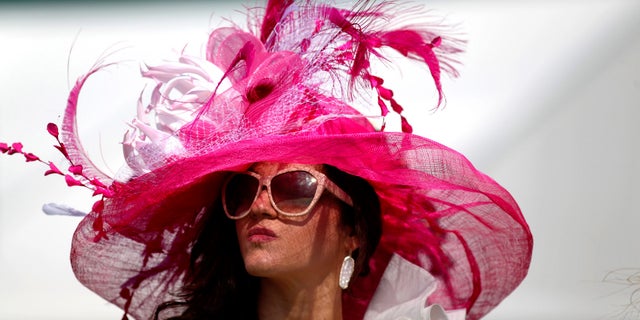 Horse racing fan Ellen Palmer wears a derby hat in the infield during the 142nd running of the Kentucky Derby at Churchill Downs.