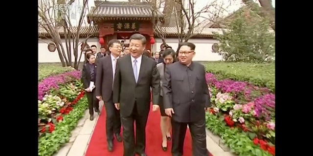 Kim Jong Un and Xi Jinping during its visit that began Sunday with Kim traveling to Beijing.