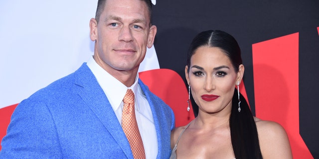 Cast member John Cena (L) and Nikki Bella attend the premiere of "Blockers" in Los Angeles, California, U.S. April 3, 2018. REUTERS/Phil McCarten - RC1DBF93F9A0