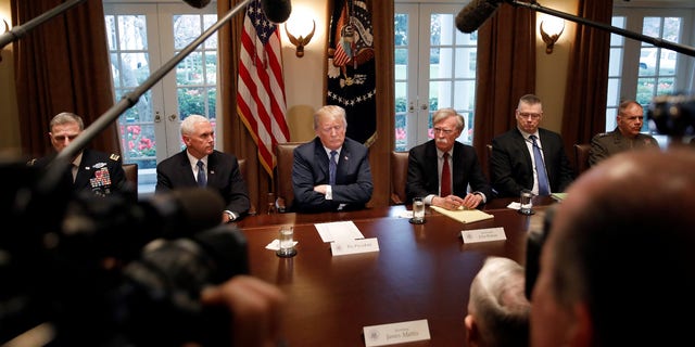 President Trump with Vice President Pence to his left, and National Security Adviser John Bolton to his right. Next to Bolton sits Deputy National Security Adviser Rick Waddell.