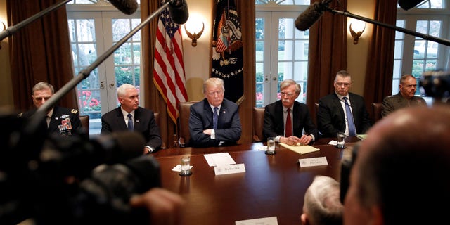 President Trump with Vice President Pence to his left, and National Security Adviser John Bolton to his right. Next to Bolton sits Deputy National Security Adviser Rick Waddell.