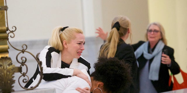 Bill Cosby accusers (L-R) Caroline Heldman, Lili Bernard and Victoria Valentino react after the guilty on all counts verdict was delivered in the sexual assault retrial.