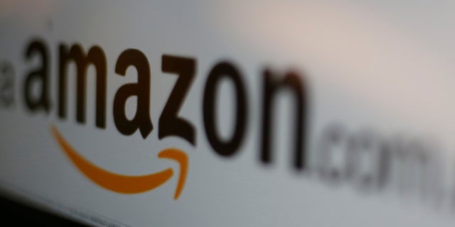 FILE PICTURE - The logo of the web service Amazon is pictured in this June 8, 2017 illustration photo. REUTERS/Carlos Jasso/Illustration/File Photo - RC1847D215A0