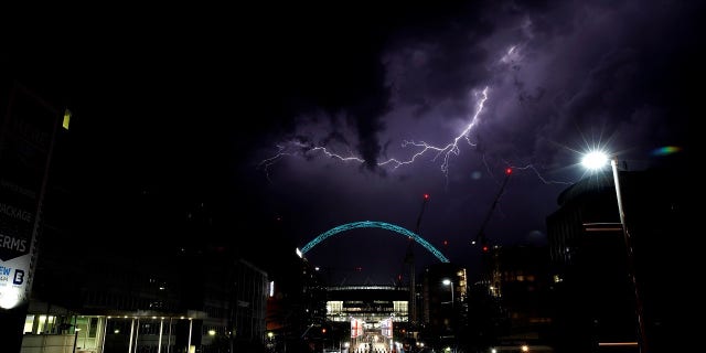 Lightning strikes above Wembley Stadium in London.