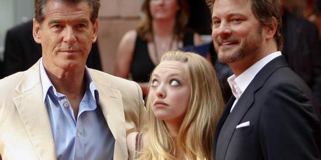 Even actress Amanda Seyfried can't get her eyes off Pierce Brosnan while promoting their film in Stockholm on July 4, 2008.